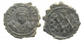 Phocas (602-610). Æ 20 Nummi (22mm, 4.80g, 12h). Antioch, year 7 (608/9). Crowned bust facing, wearing consular robes, holding mappa and eagle-tipped ...
