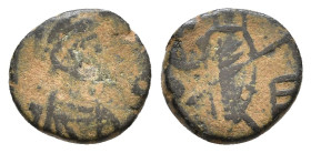 Zeno. Second reign, 476-491 AD. Æ Cyzicus or Nicomedia mint. Helmeted, draped, and cuirassed bust right / Emperor standing facing, holding standard an...