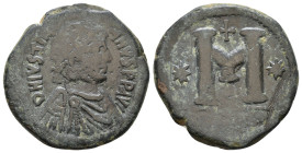 Justinian I. 527-565 AD. AE Follis. Struck 527-537 AD. Diademed, draped and cuirassed bust right; P-headed cross (chrismon) in right field / Large M f...