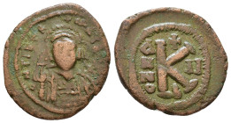 Maurice Tiberius. 582-602 AD. AE 20 Nummi. Uncertain mint, Year 2. 583/4 AD. Helmeted and cuirassed facing bust, holding globus cruciger. / Large K; a...