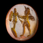 INTAILLE
Sur cornaline figurant une scène votive : Eros debout, de profil v. la gauche faisant face à un
trophée. Ligne de base. 
11 x 12 x 2 mm.
...