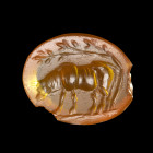 INTAILLE
Sur cornaline figurant un âne de profil v. la gauche sous un arbre. Ligne de base.
Légers éclats au bord. 
9 x 11 x 2 mm.
Art romain, Ier...