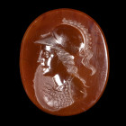 INTAILLE
Sur agate rouge figurant un buste d'Athéna casquée v. la gauche. Bouclier et égide.
23 x 27 x 4 mm.
XIXe siècle.

A 19th century agate i...