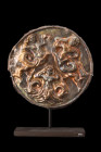 HELLENISTIC NEREIDS SILVER APPLIQUE ORNAMENT

 Ca. 350 BC
 Sheet silver applique ornament decorated in high relief with three nereids, bare-breaste...