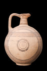 CYPRIOT BICHROME POTTERY VESSEL

 Ca. 1050-650 BC
 A pottery vessel showcases a nearly spherical body supported by a ring foot, providing stability...