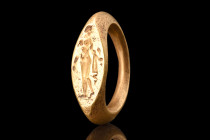 GREEK HELLENISTIC GOLD RING WITH NUDE APHRODITES

 Ca. 400 BC
 A gold ring adorned with a depiction of the standing nude Aphrodites. This enchantin...