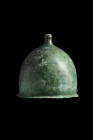 ROMAN BRONZE MONTEFORTINO HELMET - ex. Axel Gutmann

 Ca. 1st century BC - 1st century AD
 A relatively light bronze legionary helmet with a bulbou...