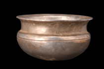 HELLENISTIC SILVER LIBATION BOWL

 Ca. 4th-3rd century BC
 A libation bowl, meticulously crafted from silver is characterized by distinct features ...