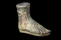 ROMAN BRONZE VOTIVE RIGHT FOOT WEARING A SANDAL

 Ca. 100-300 AD
 A bronze votive representation of a right foot, meticulously crafted to depict th...