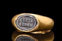 ROMAN GOLD RING WITH NICOLO CAMEO WITH INSCRIPTION 

 Ca. 100 AD
 A nicolo cameo with the inscription "ΕΥΤΙΚΙ ΕΥΓΕΝΙ" (eutiki eugeni). The phrase "...