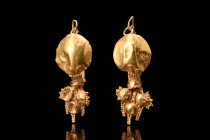 MATCHED PAIR OF ROMAN GOLD FILIGREE EARRINGS

 Ca. 100-300 AD
 A pair of gold earrings featuring a remarkable blend of sophistication and opulence....