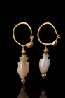 ROMANO-EGYPTAIN GOLD EARRINGS WITH ROCK CRYSTAL FISH BEADS 

 Ca. 100 BC - 100 AD
 A matched pair of gold earrings with rock crystal fish beads. Ea...