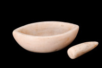 EGYPTIAN MARBLE MORTAR AND PESTLE

 Ca. 700 BC
 A mortar and pestle skillfully fashioned from marble, features a boat-shaped body with a flat base,...