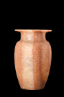 EGYPTIAN STONE VESSEL

 New Kingdom, ca. 1550-1070 BC
 A stone vessel, crafted from a captivating natural stone material. Its foundation is defined...