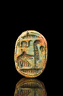 EGYPTIAN GLAZED STEATITE SCARAB

 Ca. 1550-1070 BC
 A green glazed steatite scarab with stylised incised features such as clypeus, prothorax and el...