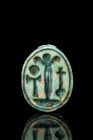 EGYPTIAN STEATITE SCARAB FLANKED BY THREE STEM PAPYRUS

 Ca. 1550-1070 BC
 A beautiful green glazed steatite scarab amulet with stylised incised fe...