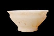 EGYPTIAN ALABASTER BOWL

 New Kingdom, ca. 1550-1070 BC
 An alabaster bowl featuring smooth walls that gracefully curve into an everted rim and a r...