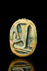 EGYPTIAN GLAZED STEATITE SCARAB WITH UREAUS AND OBELISK

 Ca. 1070-1550 BC
 A turquoise glazed steatite Egyptian scarab decorated to the reverse wi...