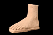 ROMAN TERRACOTTA VOTIVE LEFT FOOT

 Ca. 200BC - 200AD
 A model of a human left foot crafted from terracotta. This votive offering showcases meticul...