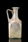 ROMAN GLASS BOTTLE

 Ca. 200-300 AD
 A graceful glass bottle emanates a sense of delicate beauty and refined elegance, captivating the viewer with ...