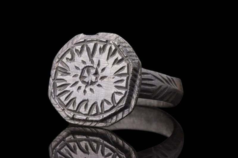 ROMAN BRONZE RING WITH SUN SYMBOL 

 Ca. 100-300 AD
 A bronze finger ring fea...