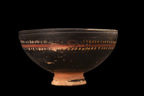 GREEK GNATHIAN DECORATED BLACKWARE CUP 

 Ca. 350 BC
 A pottery cup, crafted with precision and care by the skilled hands of ancient artisans. This...