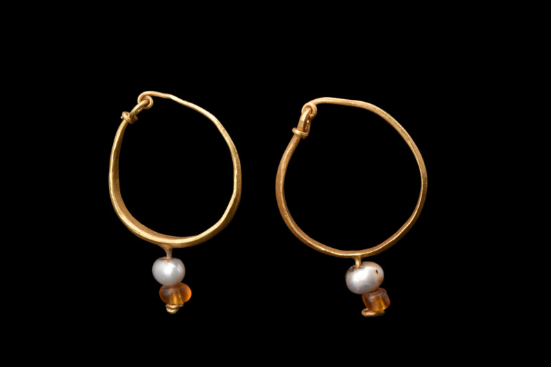 MATCHED PAIR OF ROMAN GOLD EARRINGS

 Ca. 100-300 AD
 A matched pair of gold ...