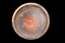GREEK BLACK-GLAZE POTTERY STEMMED PLATE

 Ca. 400-300 BC
 A pottery stemmed plate exhibits a shallow form supported by a concave foot. It features ...