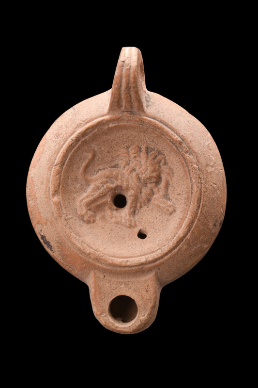 ROMAN BEIGE TERRACOTTA OIL LAMP WITH A LION

 Ca. 200-300 AD
 A terracotta oi...