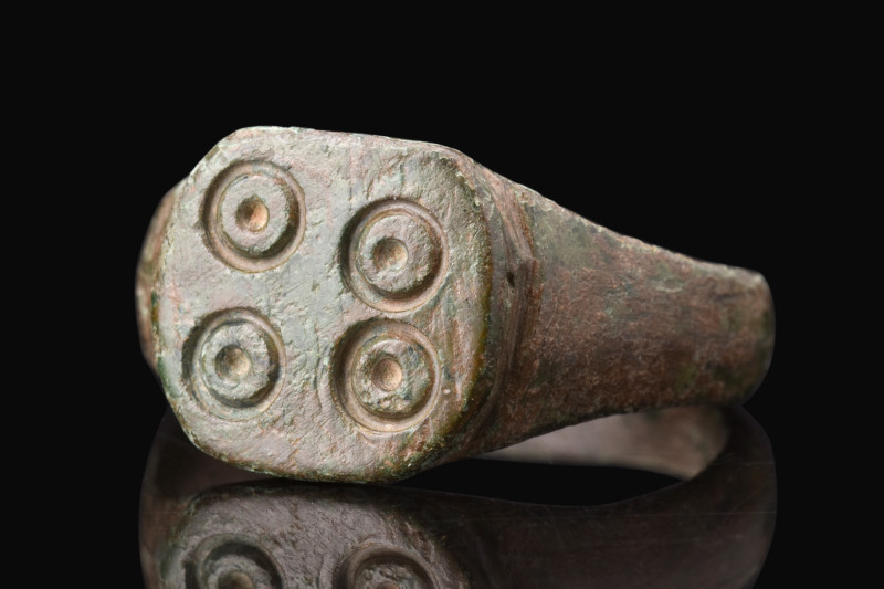 ROMAN BRONZE RING WITH SUN SYMBOLS

 Ca. 200-500 AD
 A bronze ring with a rou...