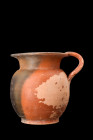 GREEK BLACK-GLAZE CUP WITH HANDLE

 Ca. 400-300 BC
 Crafted from pottery, this captivating cup boasts a well-proportioned and bulbous body that gra...