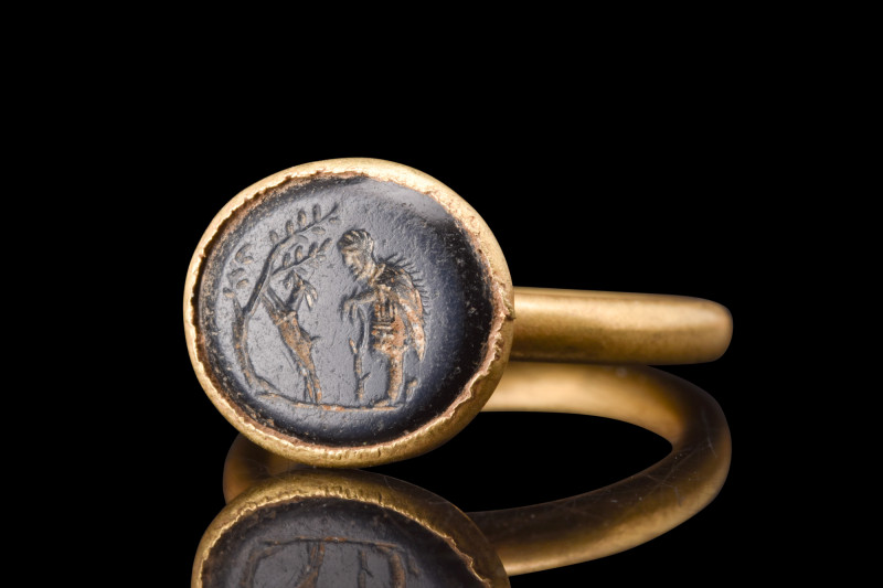 ROMAN INTAGLIO WITH BUCOLIC SCENE IN A GOLD RING

 Ca. 100-200 AD
 A black in...