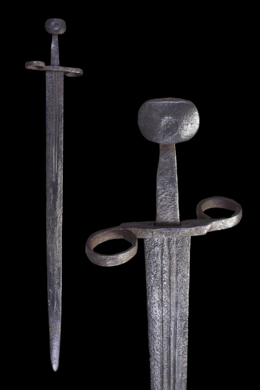 MEDIEVAL IRON SWORD

 Ca. 1300 AD
 An iron sword features a parallel double-e...