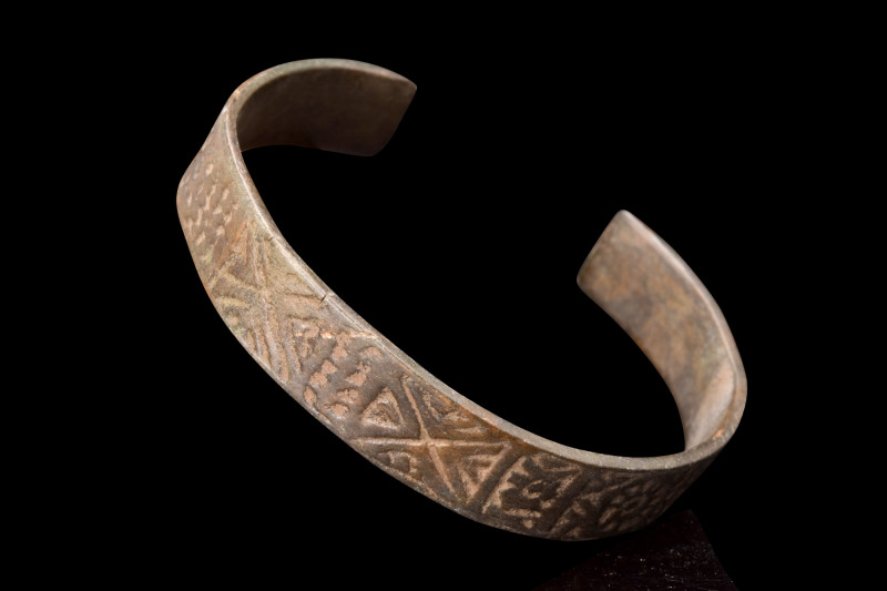 VIKING BRONZE DECORATED BRACELET

 Ca. 900-1100 AD
 A bronze bracelet, meticu...