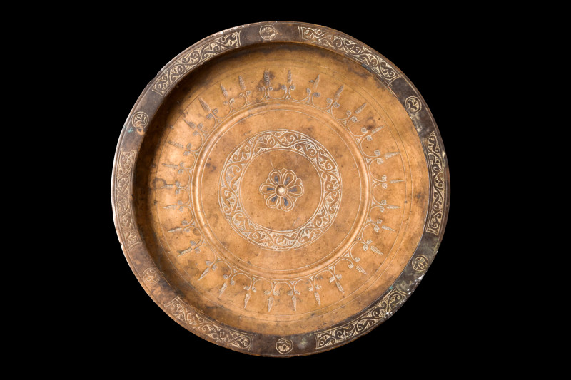 SELJUK BRASS DISH

 Ca. 1100-1200 AD
 A brass dish exhibits a distinctive for...