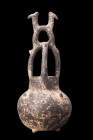 NEAR EASTERN POTTERY VESSEL WITH ANIMAL HEADS

 Ca. 2nd millennium BC
 A blackware vessel with animal heads characterized by its distinct features ...