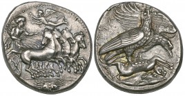 Akragas, tetradrachm, c. 410-406 BC, charioteer driving fast quadriga right, with robes billowing out behind; above, Nike flies left with wreath; in e...