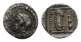 Dynasts of Lykia, Erbinna AR Obol. Circa 400-390 BC. (0.25 Gr. 8mm)
Helmeted head Athena left 
Rev. Club and bow case; between, Lykian script.