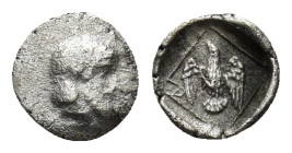 IONIA. Magnesia ad Maeandrum. Archepolis, circa 459 BC. Tetartemorion (0.21 Gr. 6mm.) 
 Bearded head of Zeus to right, his hair bound with a taenia. 
...