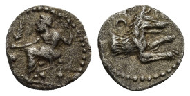 LYCAONIA. Laranda. Circa 324/3 BC. Obol (0.59 Gr. 10 mm)
 Baal seated left, holding grain ear and grape bunch in extended right hand, scepter with his...
