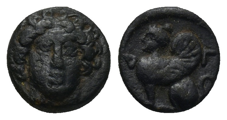 Caria, Kaunos. Ca. 386-300 B.C. AE (0.9 Gr. 9mm.). 
Facing head of Apollo 
Rev. ...