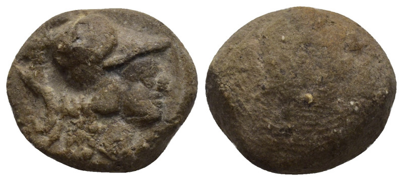 Library terracotta seal. Helmeted Athena bust right. 18mm, 2.29 gr.