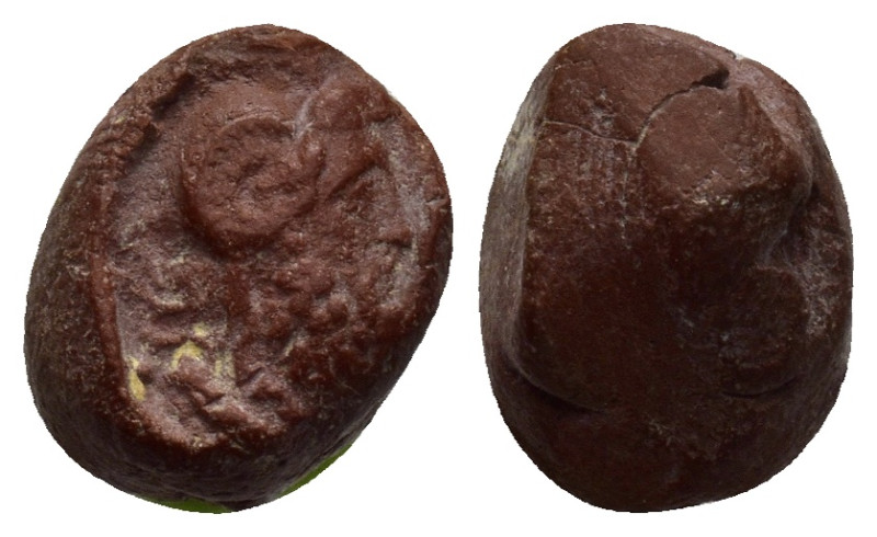 Library terracotta seal. Head of Zeus-Ammon right. 9mm, 1.21 gr.