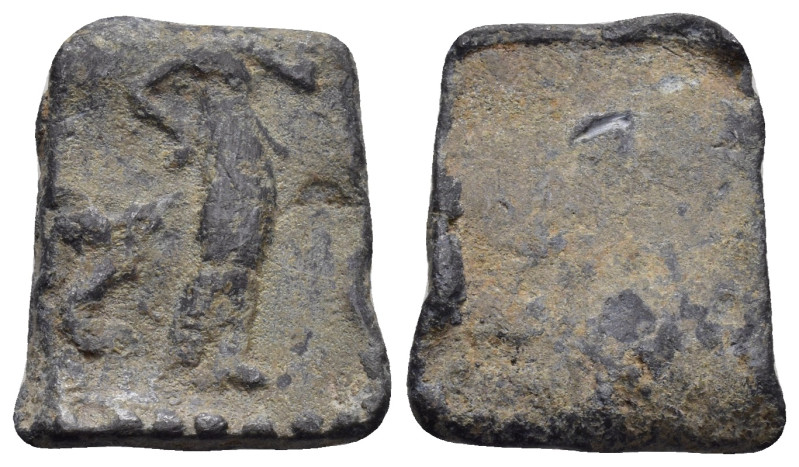 Lead square weight. Female figure standing right. 20mm, 5.65 gr.