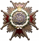 Medalla. (Guerra-65 similar). Orden de Isabel la Católica. Cruz de brazos esmaltados en rojo con filetes de oro, en el centro la Cifra Real de Fernand...