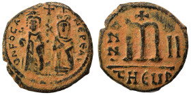 Phocas, with Leontia, 602-610. Follis (bronze, 9.55 g, 26 mm), Theoupolis (Antioch). O N FOCA NЄ PЄ AV Phocas standing facing, holding globus cruciger...