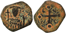 Byzantine, circa 11th century. Follis (bronze, 2.35 g, 20 mm. Nimbate Christ facing. Rev. Cross with letter in each angle. Nearly very fine.