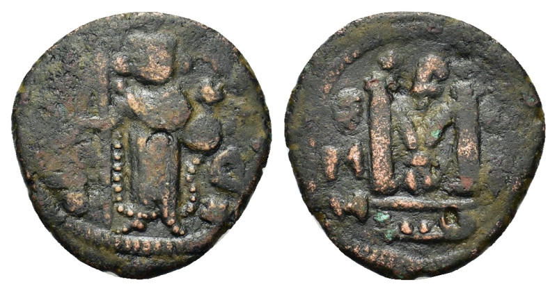 Islamic, Arab-Byzantine, Umayyad Caliphate, c. AD 661-697. Æ Fals (20,2mm, 3.8g)...