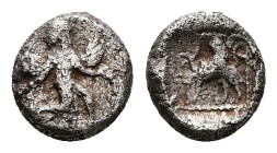Caria, Kaunos, AR Obol, 0.67 g 8.19 mm. Circa 490-470 BC.
Obv: Iris, wearing long chiton, winged shoes and winged headdress, and with curved wings and...