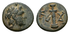 Caria, Kaunos. Ae, 1.28 g 11.11 mm. 2nd century BC.
Obv: Diademed head of Apollo right.
Rev: K - AY. Sword in sheath.
Ref: BMC 17; SNG Copenhagen 187....